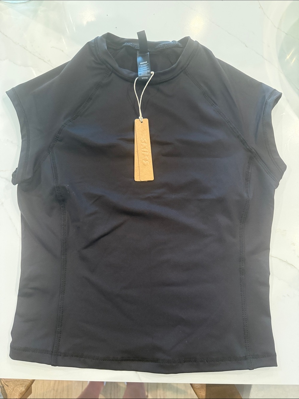 SKIMS Black short sleeve swim shirt